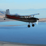 A n aircraft flying over the Great Salt Lake - Aerodynamics and the Four Forces