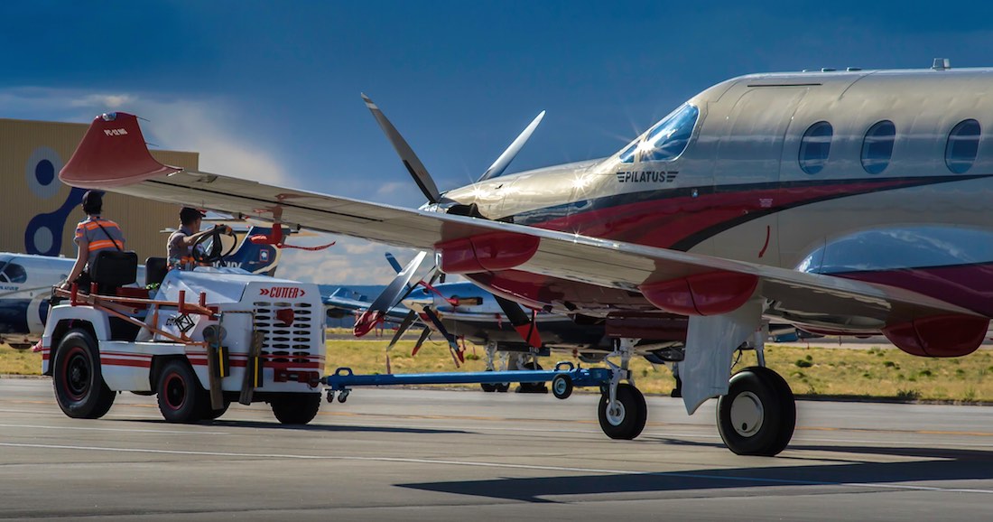 A Pilatus PC-12 being pulled by a tug - 5 Rules for Taking Great Aviation Photos