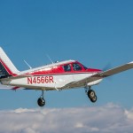 A Piper Cherokee in flight, with a flight instructor and student pilot - Why Are Fewer People Pursuing a Pilot License?