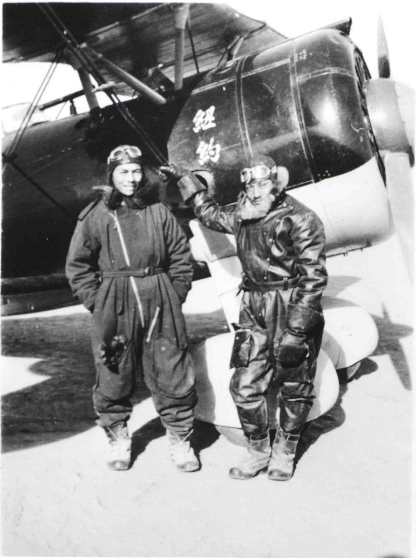 World War 2 fighter pilot Arthur Chin standing next to a Russian-built Polikarpov I-152 biplane fighter.