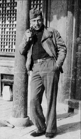 World War 2 flying ace Arthur Chin posing with a pipe, in China.