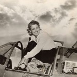 Jacqueline Cochran, or Jackie Cochran, emerging from the cockpit of an airplane.
