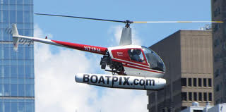 A Robinson R22 Helicopter, Mariner variant, in flight.