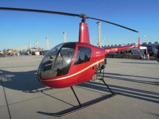 A Robinson R-22 Helicopter on the runway.