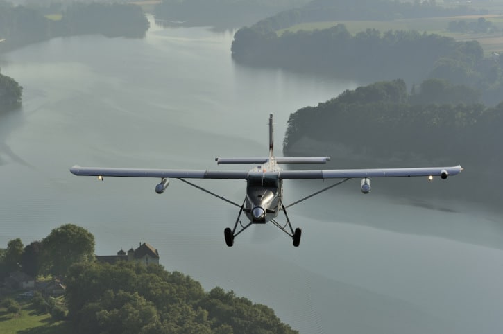 Pilatus PC-6 Turbo Porter in flight over the countryside
