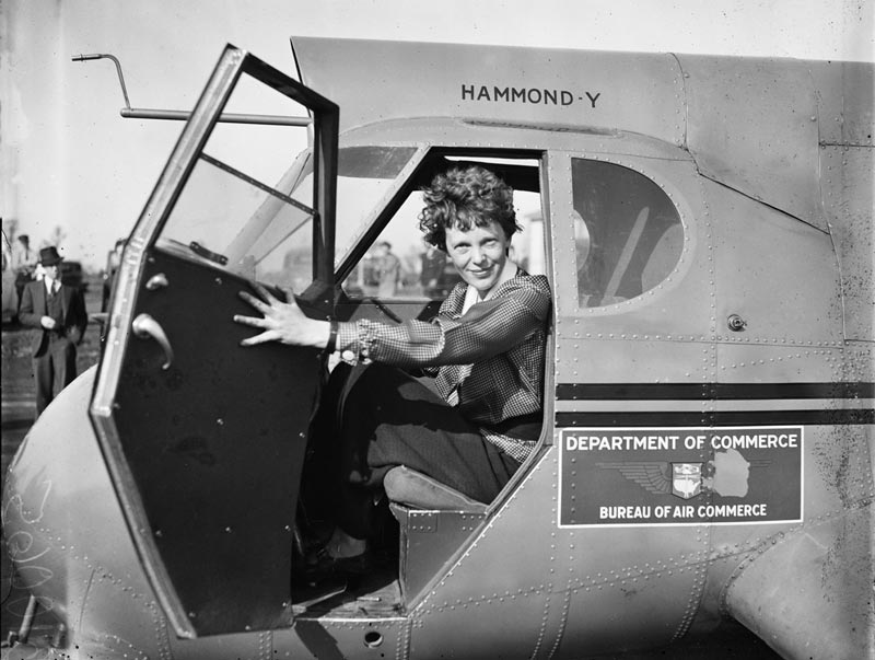 Amelia Earhart in an airplane cockpit