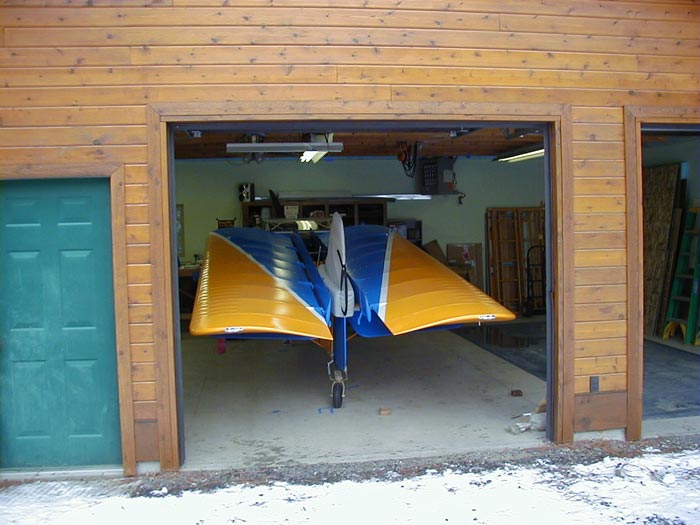 Kitfox airplane in garage with wings folded