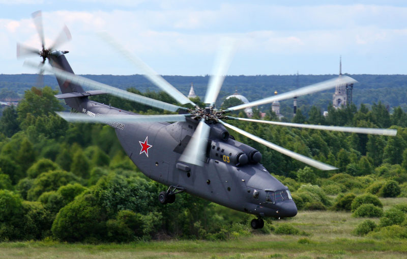 The world's largest helicopter, the Mi-26, in flight over Russian countryside