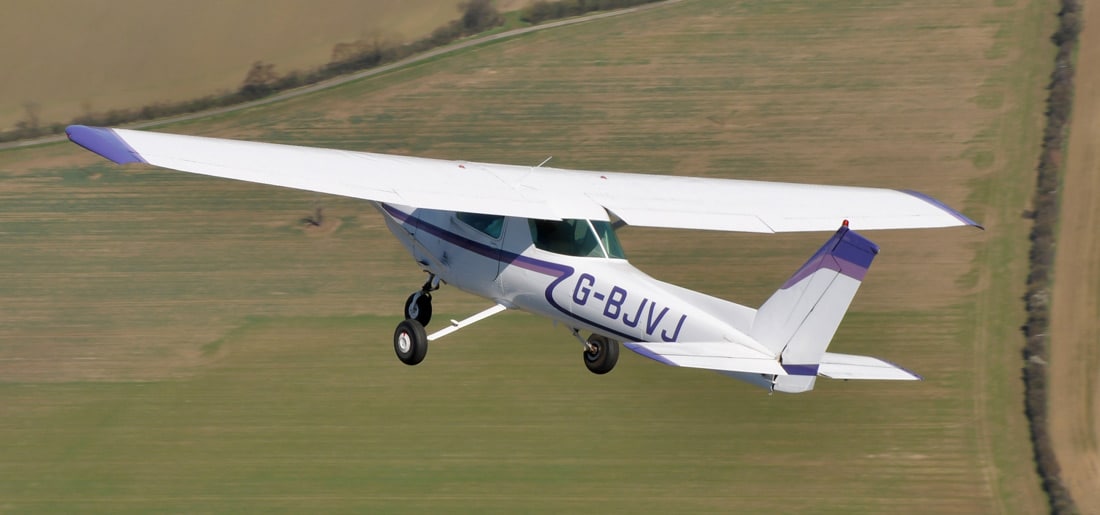 A Cessna 152 airplane in flight