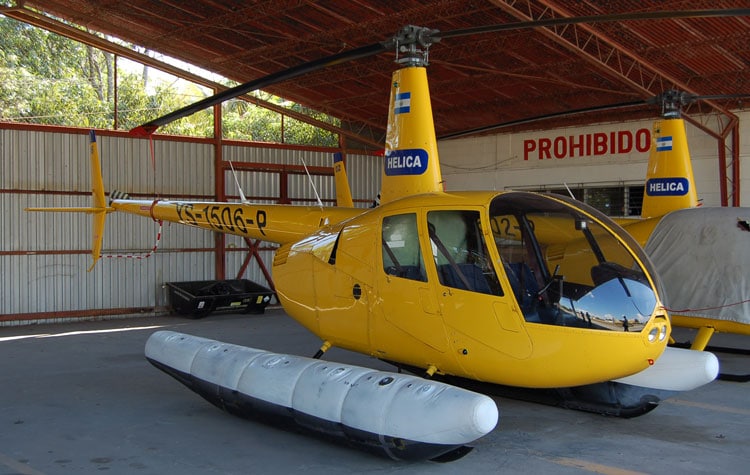 A Robinson R44 Helicopter with floats