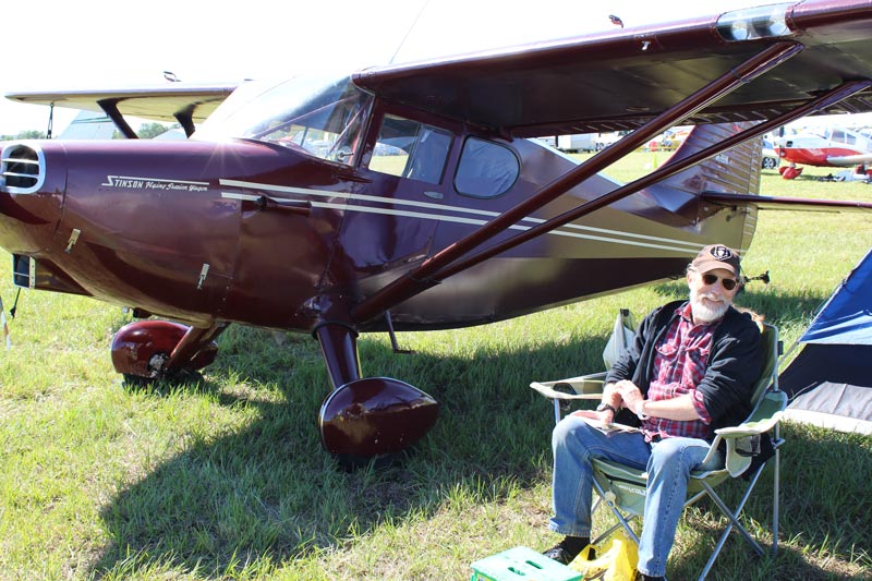 1949 Maroon Stinson aircraft with private pilot Dean Baker