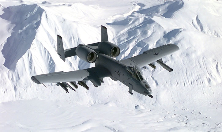 An A-10 THunderbolt II, or A-10 Warthog, flying over the snow