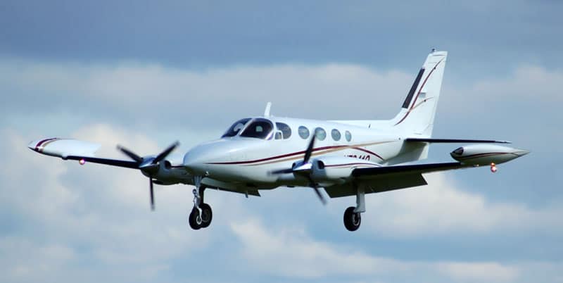 Cessna 340 flying against the clouds