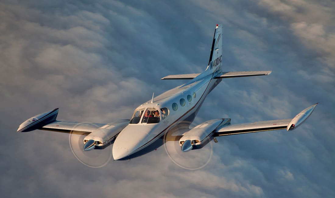 Cessna 340 In flight above the clouds