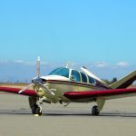 A Beechcraft Bonanza in parking at an airport - FAA's NORSEE Policy Promotes Installation of Safety Equipment