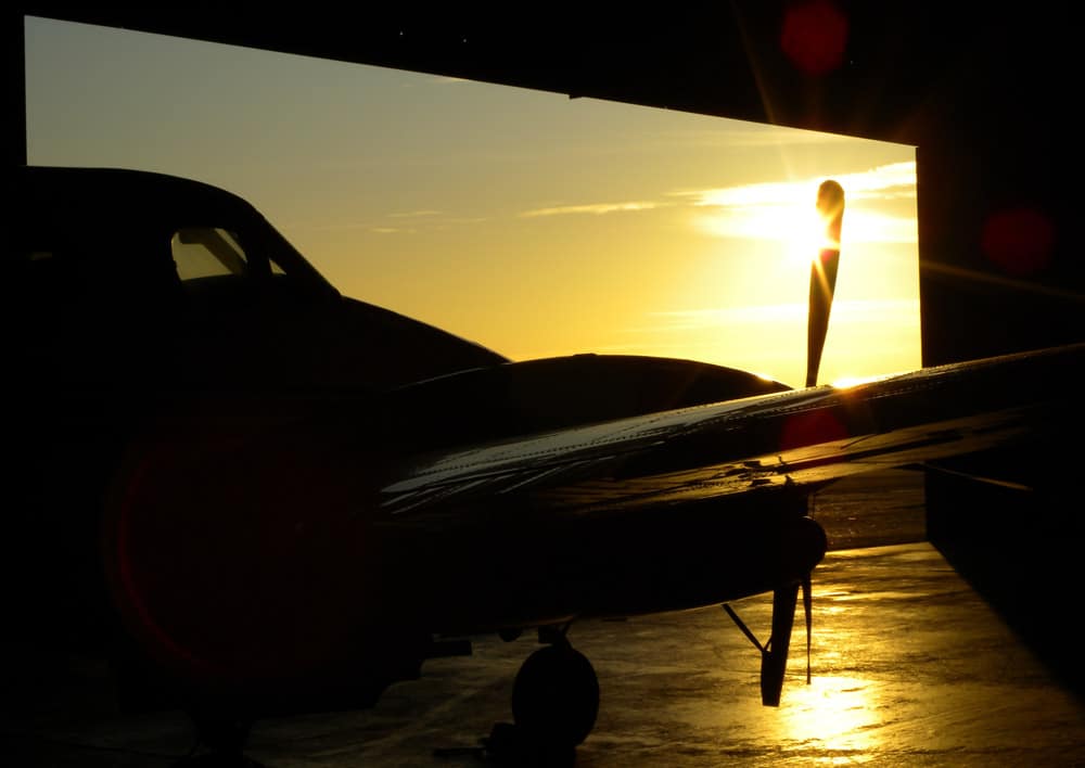 An aircraft in a hangar at sunset - New HangarBot system revealed to help secure hangars