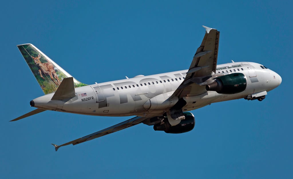 Frontier Airlines aircraft in flight - Frontier Pilots Request Federal Mediator in Contract Dispute