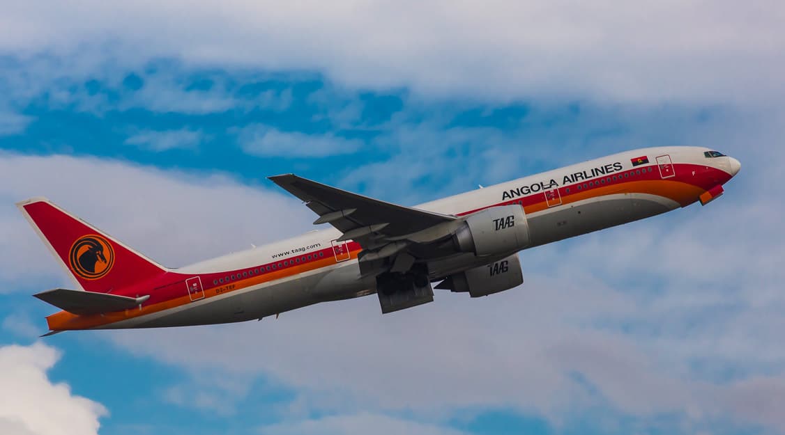 An Angola Airlines Boeing 777 - Angola Airlines Flight DT6544 makes emergency landing to free baggage handler from cargo area