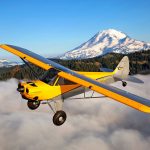 CubCrafters Carbon Cub SS in flight - CubCrafters announces new retrofit airframe parachute systems for select aircraft models