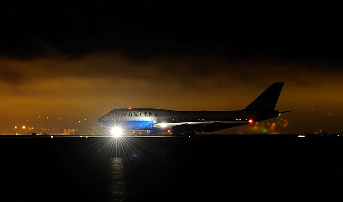 United Airlines Boeing 747 aircraft on the runway at night