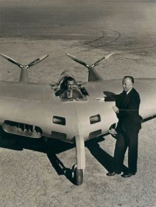 jack northrop posing with flying wing prototype