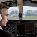 Man wearing a Zulu 3 headset in the cockpit