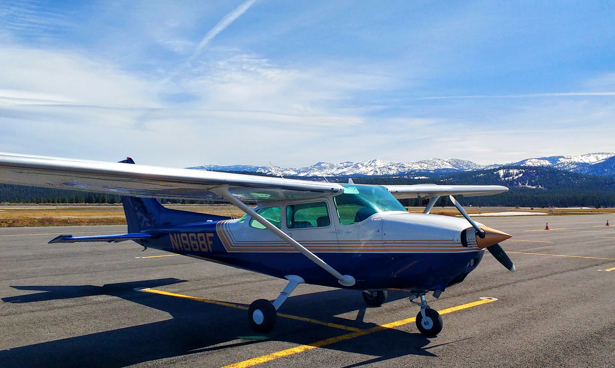 A Cessna Skyhawk 172 on the runway at Tahoe Truckee Airport, just before a flying in turbulence to Reno-Stead Airport