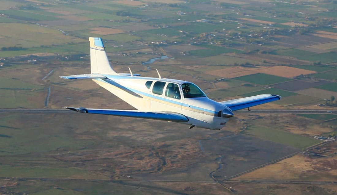 Beechcraft Debonair in flight, with an IO-470 engine, which might be affected by a recent Continental engine service bulletin being upgraded to mandatory