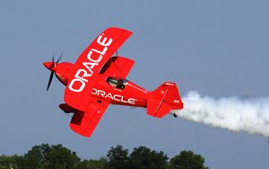 famous airshow pilot sean tucker flying his red biplane for team oracle
