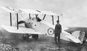 Captain GF Malley of the Australian Flying Corps standing next to his Sopwith Camel in 1918. Image is in the public domain. 