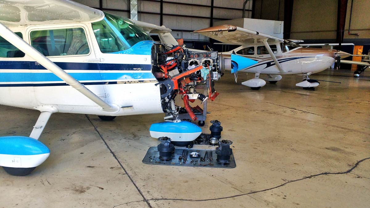 A Cessna 182 being worked on by a mechanic - Using the Airplane Squawk Sheet and Squawk Etiquette