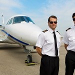 Portrait of confident pilots standing in front of private jet - The Right Pilot Seat For You