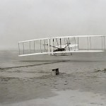 The historic photo captured by John T. Daniels of the Wright Brothers powered first flight - First Flight: the Wright Brothers