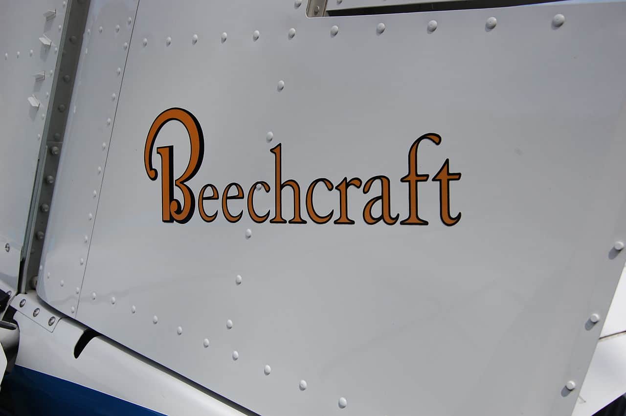 The Beechcraft logo on a small aircraft.