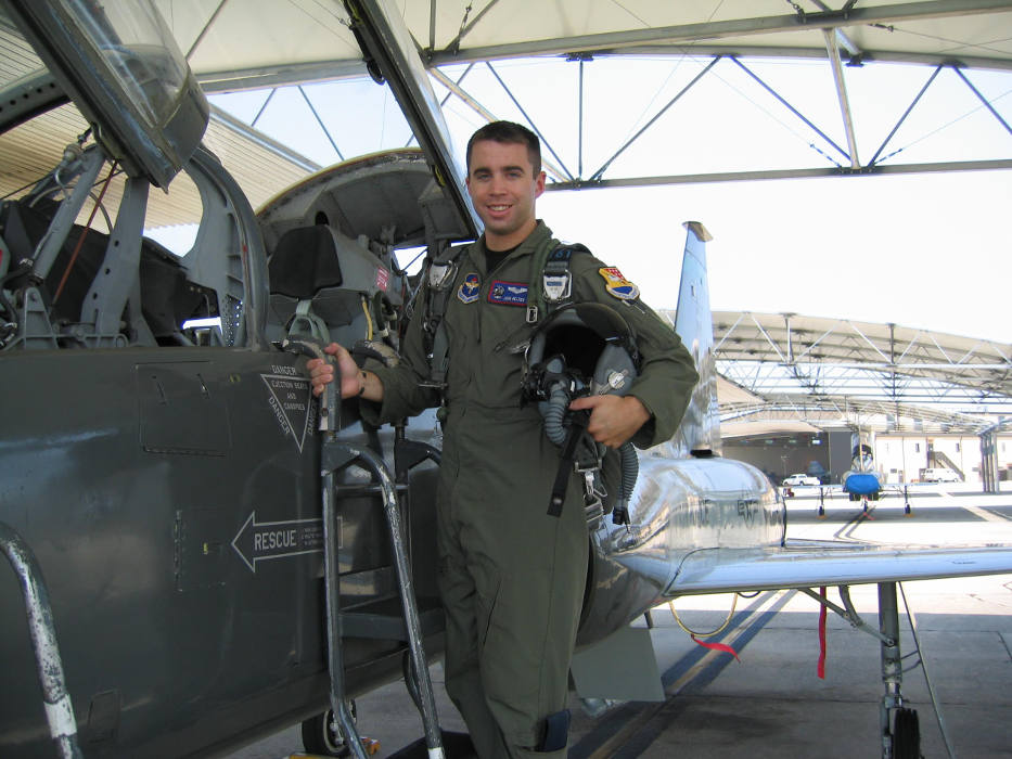 Air Force service member preparing for a flight in a Northrop T-38 Talon. 