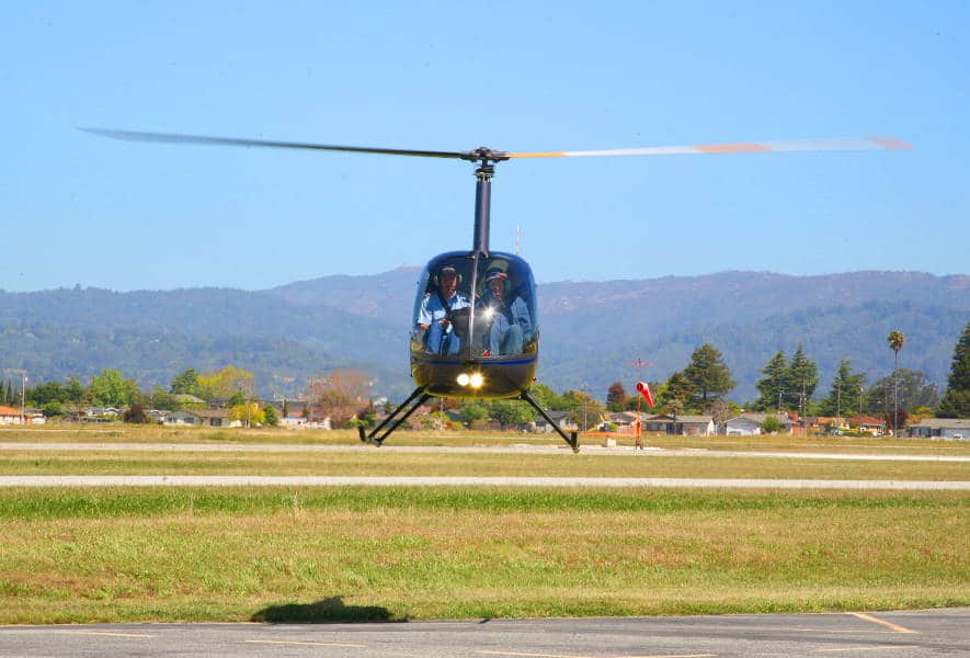 A Robinson R-22 helicopter hovering, after SFAR 73 was in place.