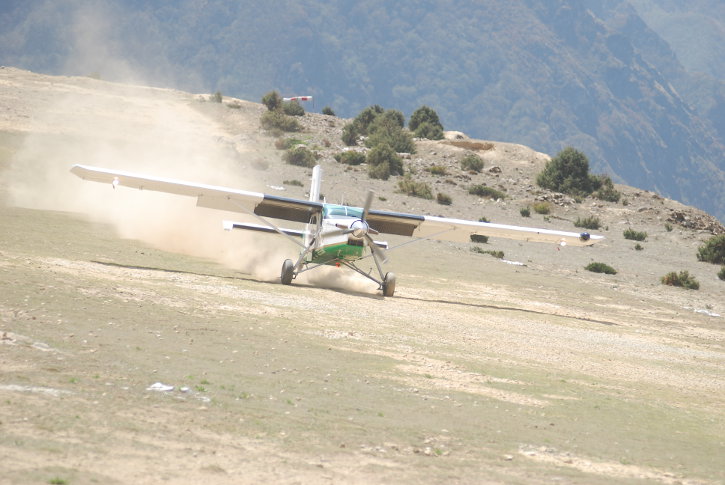 The Pilatus Porter landing on a dirt airstrip