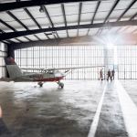 Pilots leaving a flight training school hangar - Are All Airline Pilot Training Schools the Same?