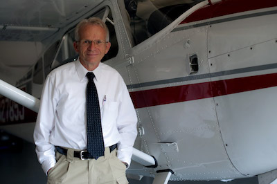 Pilot and Auhtor Steve Durtschi standing next to his Cessna 185 Skywagon