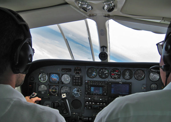 Two private pilots in the cockpit of a Cessna 340