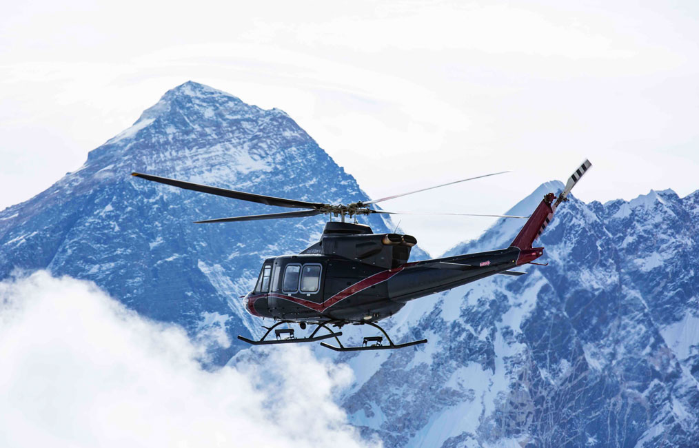 Bell 412EPI Helicopter in flight by Mount Everest
