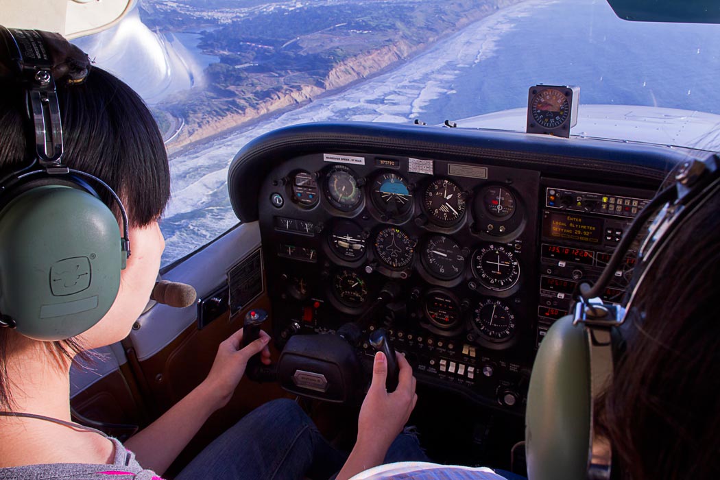 Female pilot flying a Cessna 172 Skyhawk - Women In Aviation Scholarship Applications Now Being Accepted