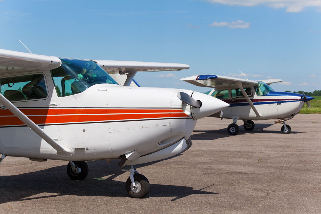 Small aircraft in parking at an airport - Golbal Air accepting applications for the Calvin L. Carrithers Aviation Scholarship