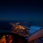 Aerial view of city from a cockpit - Why Give a Pilot a Night Rating and Not Let Them Use It?