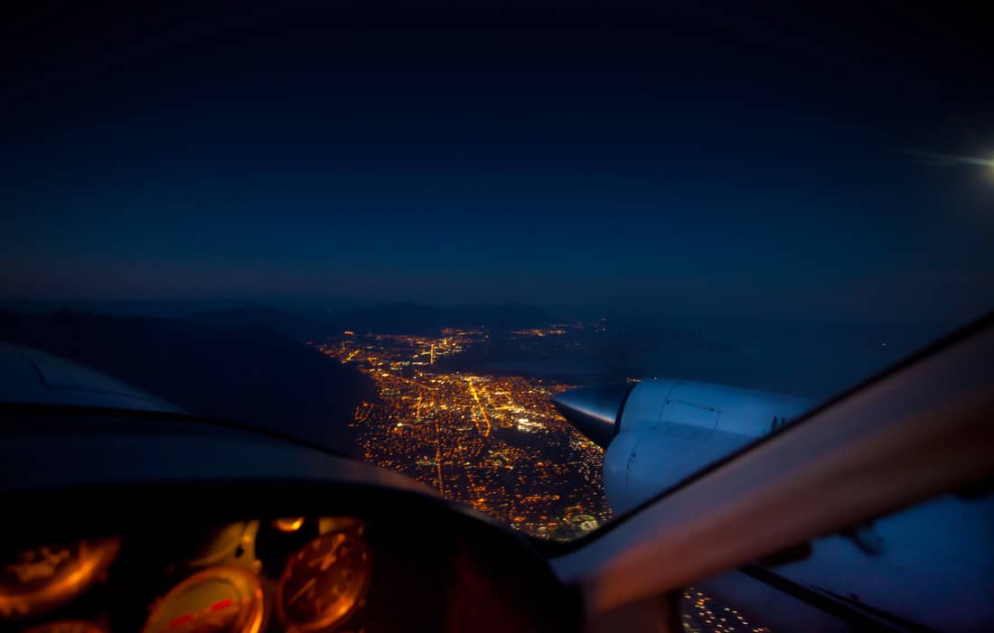 Aerial view of city from a cockpit - Why Give a Pilot a Night Rating and Not Let Them Use It?