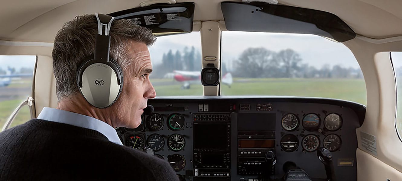 Man wearing a Zulu 3 headset in the cockpit