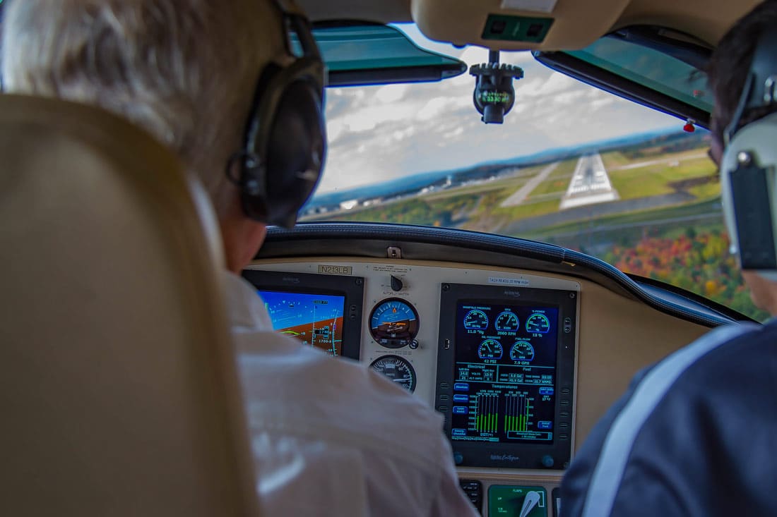 Private pilots in an aircraft cockpit during a crosswind landing