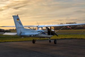 cessna 150 parked at sunrise