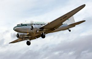 douglas dc-3 airliner flying, gear down