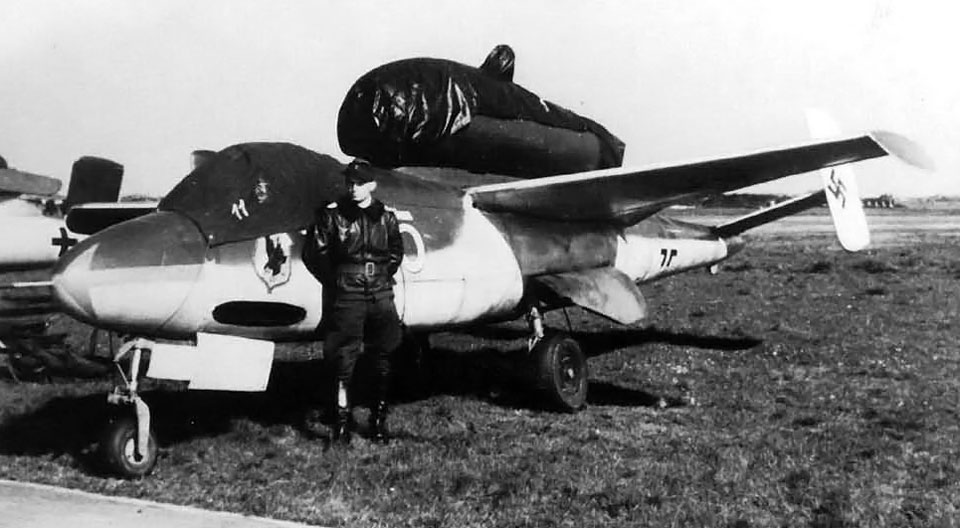 The Heinkel He 162 Volksjager and a pilot.